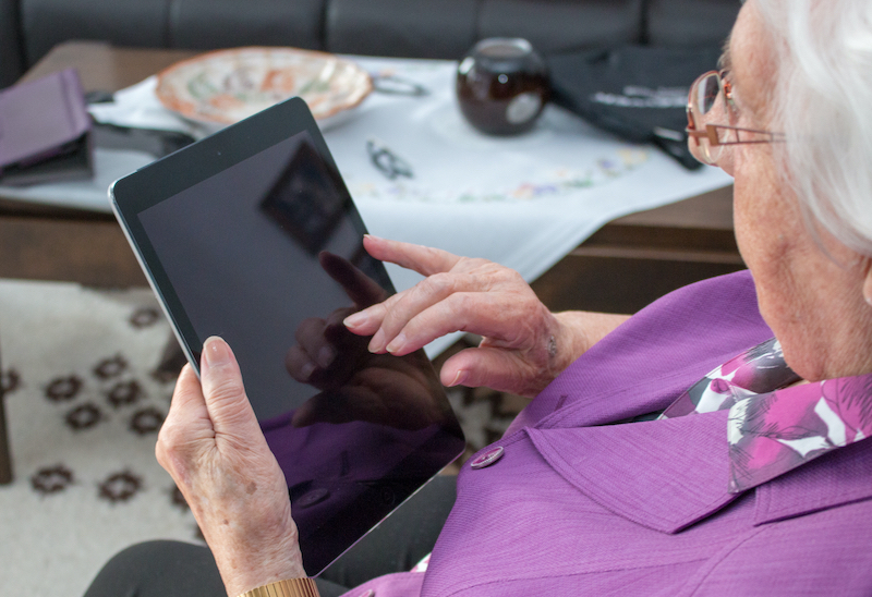 shutterstock old woman elderly iPad internet