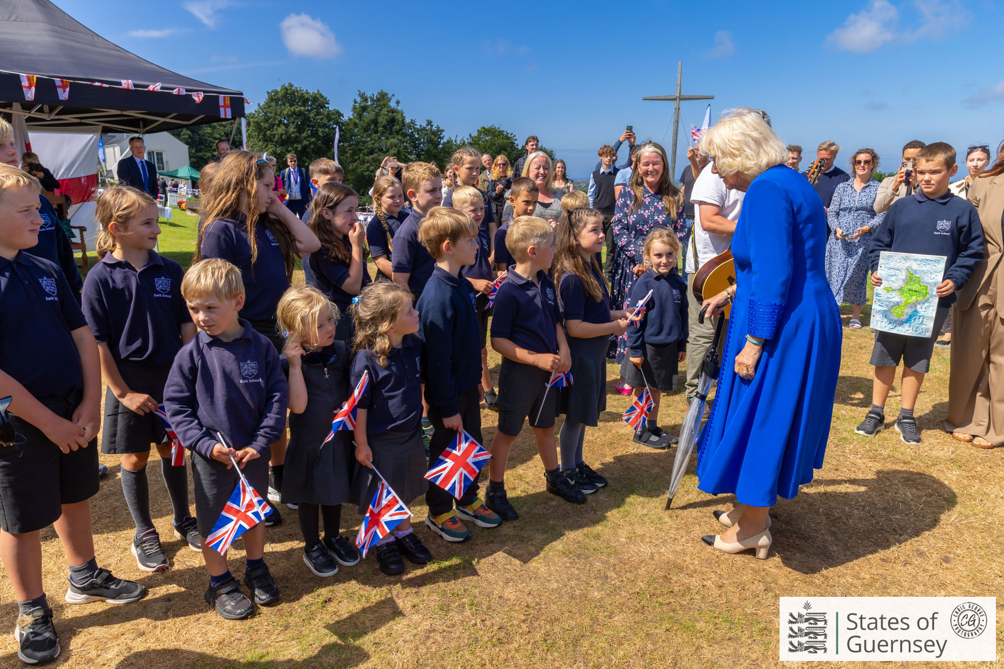 Queen Camilla wearing the blue bracelet made and gifted by Mia Craik. (Chris George)