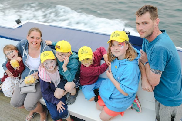 Baker Family on the boat smile for Georgie