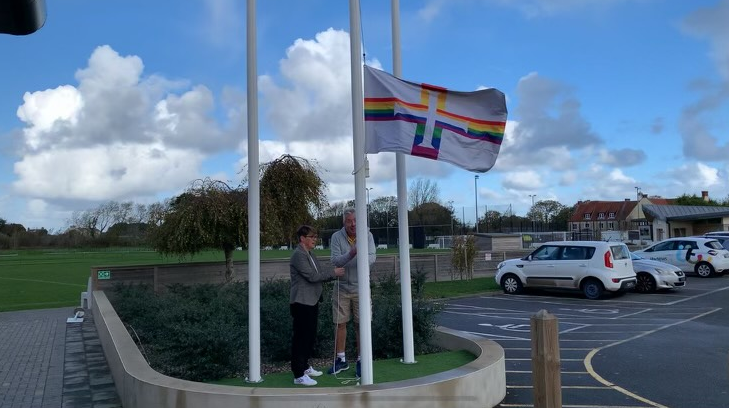 Ellie_Jones_and_Alun_Williams_raising_the_Pride_flag_at_the_KGV.png