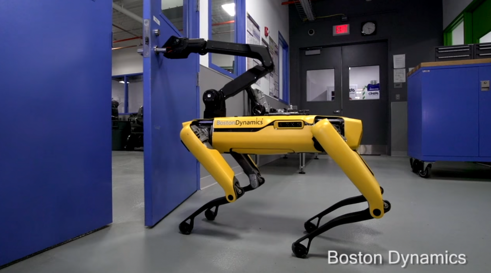 Watch this Boston Dynamics dog-like robot open a door using its creepy arm