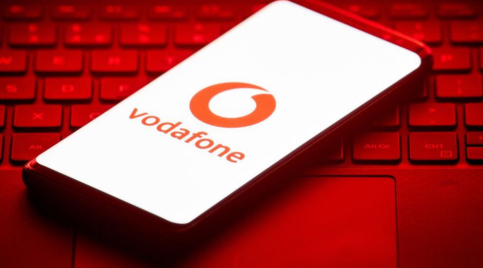 Vodafone swings to £6.6 billion loss and cuts divi for first time