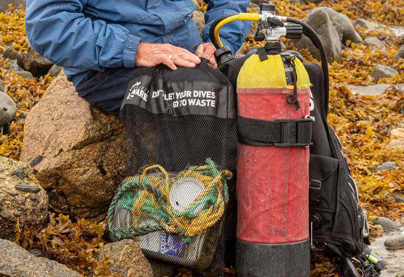 Local divers and Condor in underwater clean up