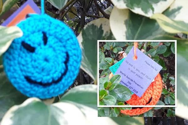 Knitted faces raising awareness and smiles