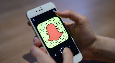 Snapchat reveals rise in user numbers and revenue as losses shrink