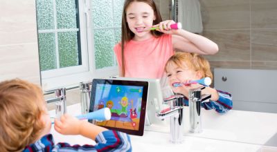 This electric toothbrush uses games to encourage kids to brush their teeth