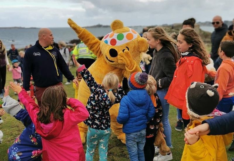 Families enjoy a teddy bear's picnic