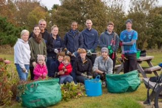 Volunteers from Saffery Champness help clear up Delancey Park